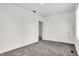 This bedroom features gray carpet, neutral walls, and multiple closets at 3628 N Illinois St, Indianapolis, IN 46208
