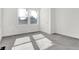 Bedroom with large window and neutral walls, carpet and trim creating a clean living space at 3628 N Illinois St, Indianapolis, IN 46208