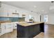 Kitchen features an island, sleek stainless steel appliances, and seamless transition to the living area at 3628 N Illinois St, Indianapolis, IN 46208