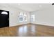 Bright living room with newly installed floors, fresh white walls, and modern finishes at 3628 N Illinois St, Indianapolis, IN 46208