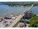 Expansive aerial view of a lakeside community with boats, a bridge, and charming buildings at 3646 Beach Blvd, Cicero, IN 46034