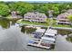Waterfront townhomes feature private boat docks and lovely green spaces, perfect for lakeside living and enjoyment at 3646 Beach Blvd, Cicero, IN 46034