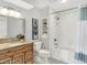 This bathroom offers a tub shower combo, framed mirror and granite vanity at 3646 Beach Blvd, Cicero, IN 46034