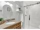 Updated bathroom featuring a granite countertop, modern fixtures, and a glass-enclosed shower at 3646 Beach Blvd, Cicero, IN 46034