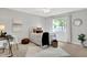 Comfortable bedroom showcasing a ceiling fan, window with backyard views and ample natural light at 3646 Beach Blvd, Cicero, IN 46034