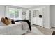 Well-lit bedroom with a large window and a closet featuring a washer and dryer at 3646 Beach Blvd, Cicero, IN 46034