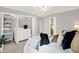 Bright bedroom featuring a ceiling fan and a convenient washer and dryer closet at 3646 Beach Blvd, Cicero, IN 46034