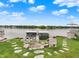 Lakeside view featuring a stone path leading to a dock with multiple boat slips and a 'no trespassing' beach sign on the lawn at 3646 Beach Blvd, Cicero, IN 46034