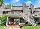 Exterior rear view of a multi-story townhouse featuring private patios and staircases at 3646 Beach Blvd, Cicero, IN 46034