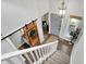 Inviting entryway with a modern barn door, staircase, and stylish lighting fixture at 3646 Beach Blvd, Cicero, IN 46034