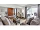 Comfortable living room featuring a murphy bed, neutral decor, and a sliding glass door to the outside at 3646 Beach Blvd, Cicero, IN 46034