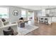 Open-concept living room with a view of the lake, modern furnishings, and a kitchen island at 3646 Beach Blvd, Cicero, IN 46034