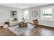 Cozy living room with hardwood floors, modern furniture, and scenic views of the lake at 3646 Beach Blvd, Cicero, IN 46034