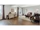 Cozy living room with a desk area, neutral decor, and sliding glass door to outdoor space at 3646 Beach Blvd, Cicero, IN 46034
