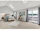 Bright main bedroom with vaulted ceiling, ensuite balcony access, and comfortable bedroom set at 3646 Beach Blvd, Cicero, IN 46034