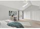 Sun-filled main bedroom boasts a vaulted ceiling, skylight, slider door access and dual door closet at 3646 Beach Blvd, Cicero, IN 46034