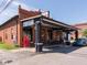 Charming restaurant exterior featuring an inviting outdoor seating area and vintage Coca-Cola machine at 3646 Beach Blvd, Cicero, IN 46034