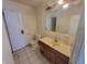 Bathroom featuring a vanity, toilet, and a mirror at 3755 N Brentwood Ave, Indianapolis, IN 46235