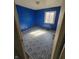 Bright bedroom featuring blue walls, natural light and tile flooring at 3755 N Brentwood Ave, Indianapolis, IN 46235