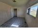 Bedroom featuring closet, window with natural light, and tile flooring at 3755 N Brentwood Ave, Indianapolis, IN 46235