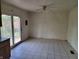 An empty dining area with tile flooring, and glass patio doors overlooking the outdoor scenery at 3755 N Brentwood Ave, Indianapolis, IN 46235