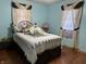 Cozy bedroom with a large bed, plush pillows, and decorative window curtains at 3883 N 150 W, Columbus, IN 47201