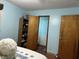 Bedroom showing a view into an ensuite bathroom and a closet at 3883 N 150 W, Columbus, IN 47201