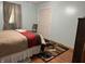 Bedroom with neutral walls, hardwood floors, and a double door closet at 3883 N 150 W, Columbus, IN 47201