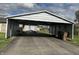 Metal carport showing a paved driveway and space for parking vehicles at 3883 N 150 W, Columbus, IN 47201