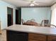 Cozy kitchen and dining area featuring oak cabinets, a dishwasher, and a breakfast bar at 3883 N 150 W, Columbus, IN 47201