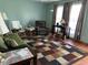 Inviting living room featuring bright windows, cozy seating, and colorful area rug on a wood floor at 3883 N 150 W, Columbus, IN 47201