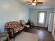 Functional mud room with durable wood floors, comfortable seating, and an exterior door at 3883 N 150 W, Columbus, IN 47201