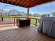 Open back porch overlooking a huge yard with a basketball court for outdoor fun at 4205 Hunt Club Pkwy, Bargersville, IN 46106