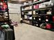 Unfinished basement with shelving units filled with storage containers and exposed ceiling at 4205 Hunt Club Pkwy, Bargersville, IN 46106