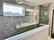 En Suite bathroom features a glass enclosed shower, grey tile and a view of the outdoors at 4205 Hunt Club Pkwy, Bargersville, IN 46106