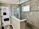 En Suite bathroom features a glass enclosed shower, grey tile and access to the Main Bedroom at 4205 Hunt Club Pkwy, Bargersville, IN 46106