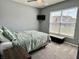Relaxing bedroom features a large window, neutral walls, and a comfy bed at 4205 Hunt Club Pkwy, Bargersville, IN 46106