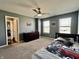 Cozy bedroom with neutral walls, plush carpet, and a race car bed spread at 4205 Hunt Club Pkwy, Bargersville, IN 46106