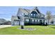 Beautiful two story home with manicured lawn, gray siding and stone facade with a two car garage at 4205 Hunt Club Pkwy, Bargersville, IN 46106