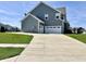 Home featuring an attached two-car garage and a long driveway leading to the street at 4205 Hunt Club Pkwy, Bargersville, IN 46106