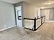 Spacious upstairs hallway with carpet and decorative white railing at 4205 Hunt Club Pkwy, Bargersville, IN 46106