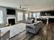 Open-concept living area showcases a fireplace, seating, and flows into the kitchen and dining room at 4205 Hunt Club Pkwy, Bargersville, IN 46106