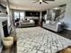 The expansive living area features a fireplace, lots of seating, an open concept, and dark hardwood floors at 4205 Hunt Club Pkwy, Bargersville, IN 46106