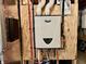 Close up of a wall mounted A. O. Smith tankless water heater in an unfinished space at 4205 Hunt Club Pkwy, Bargersville, IN 46106