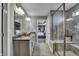 Modern bathroom featuring a glass enclosed shower with built-in bench and double vanity at 4249 Brocket Dr, Greenwood, IN 46143