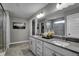 Elegant bathroom featuring a double vanity, large mirror, and glass-enclosed shower for a spa-like feel at 4249 Brocket Dr, Greenwood, IN 46143