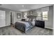 Beautiful bedroom showcasing a well-styled bed, dark furniture, and natural light at 4249 Brocket Dr, Greenwood, IN 46143