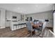 Bright kitchen with a large island and modern cabinetry adjacent to an open dining area at 4249 Brocket Dr, Greenwood, IN 46143