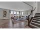 Bright living room with hardwood floors, comfortable sofas, large windows, and modern decor at 4249 Brocket Dr, Greenwood, IN 46143