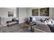 Comfortable seating area with a gray sofa, unique wooden wall decor, and a stylish coffee table at 4249 Brocket Dr, Greenwood, IN 46143
